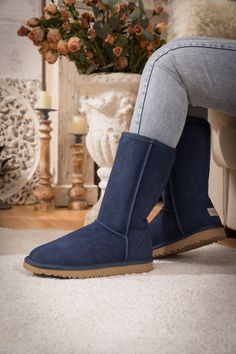 Stay warm in chic, eye-catching style when you pull on these most classic mid length style that features genuine suede leather and a plush faux fur-lining keep your feet warm. 1'' heel 11.5'' shaft 15.8'' circumference Pull-on Suede upper Faux fur lining Man-made EVA sole Classic Sheepskin Boots For Fall, Casual Mid-calf Boots With Suede Lining For Winter, Navy Round Toe Boots For Winter, Navy Blue Ugg Boots, Ugg Style, Reindeer Headband, Navy Shoes, Ugg Classic, Eva Sole