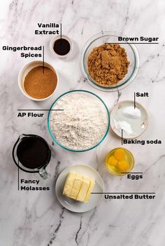 ingredients to make chocolate cake laid out on a white marble counter top with text below