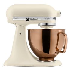 an image of a white mixer with gold accents on the front and bottom part, isolated against a white background