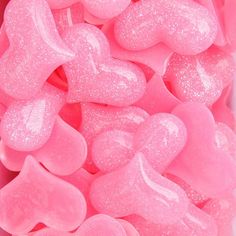 pink candy hearts are in a plastic container