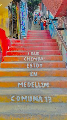 there are many steps painted in different colors and words on the stairs that lead up to them