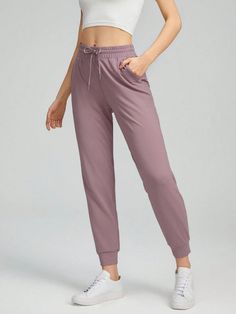 Features:4-Way Stretch \nActivity:Daily & Casual \nDetails:Drawstring \nDetails:Drawstring Waist \nDetails:Elastic Waist \nWaist Line:Natural \nDetails:Pocket \nFit Type:Regular Fit \nType:Tapered/Carrot \nColor:Dusty Purple \nPattern Type:Plain \nLength:Cropped \nFabric:High Stretch \nMaterial:Knitted Fabric \nComposition:83% Polyester \nComposition:17% Elastane \nCare Instructions:Machine wash, do not dry clean \nPockets:Yes \nSheer:No \n Sports Pants Women, Dusty Purple, Women Sports, Sports Pants, Sport Pants, Drawstring Waist, Knitted Fabric, Casual Women, Elastic Waist