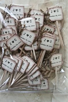 there are lots of clothes pins with words on them in the package and some stickers