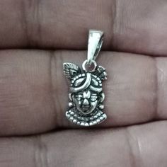 Dainty Krishna Pendantade in sterling silver. Dimension(approx): Drop( incl. Bail) - 2.2 cm Width - 1 cm Krishna Face, Krishna Pendant, Feather Crown, Face Pendant, Peacock Feather, Pendant Silver, Pendant Necklaces, Krishna, Silver Pendant