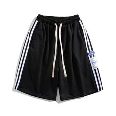 These Street Stripe Label Shorts feature a unique and stylish design. Perfect for any casual or semi-formal occasion, the shorts offer comfort and convenience with their elastic waistband. Crafted in a lightweight fabric, these shorts have a classic design with subtle side pockets. Features: -100% Polyester -Mid-rise Waist -Straight Leg -Adjustable Waistband -Regular Fit -Street Style Sporty Side Stripes Shorts For Summer, Sporty Summer Shorts With Side Stripes, Leisure Knee-length Bottoms With Built-in Shorts, Casual Sports Shorts With Side Stripes, Casual Athletic Shorts With Side Stripes For Summer, Casual Summer Athletic Shorts With Side Stripes, Spring Streetwear Shorts With Drawstring, Casual Cotton Bottoms With Side Stripes, Spring Bermuda Athletic Shorts With Built-in Shorts