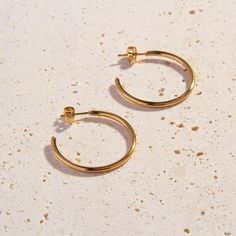 Introducing our 18k Gold Plated Classic Hoops, the prettiest delicate hoops for day or evening wear. The Classic Hoops are slightly thinner than our popular Cali Hoops. These perfectly weighted earrings are light and comfortable to wear throughout your busiest days. Stock your jewellery box with these essential hoops! Details:   3cm Diameter   18k Gold Plated   FREE Insured Shipping (Worldwide) Timeless Jewelry, Formal Looks, Elegant Earrings, Gold Plated Jewelry, Jewelry Plate, Ring Bracelet, Earring Necklace, Evening Wear, Chains Necklace