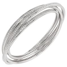 This gorgeous Cartier bracelet from the iconic Trinity collection features 3 interconnected bangles made in 18k white gold and set with brilliant-cut round D-E-F VVS1-VVS2 diamonds. Fits small wrist measuring 6.5 to 7 inches. Made in France circa 1990s. Measurements: 0.35" (9mm) width, 7" (17.7cm) length. Excellent condition. Comes with original pouch and Cartier service paperwork. Cartier Trinity Bracelet, Vintage Cartier Watch, Cartier Bangle, Trinity Bracelet, Bracelet Cartier, White Gold Bangle, Cartier Bracelet, Large Bracelet, Small Bracelets