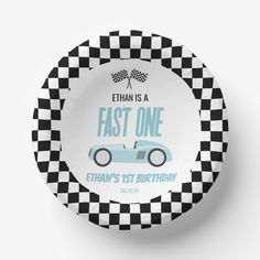 a paper plate with an image of a race car and the words fast one on it