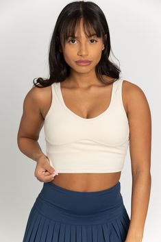 Our Light Cream Lined Crop Bra Top is a Best Seller of ours that we continue to have to restock because of its popularity! Aside from its flattering fit on any body type, it offers functionality with removable padding option and support. Just like its name, it can be worn as an sports bra top or dressed differently as an everyday, lounge top. Fitted Beige Sports Bra With Built-in Bra, Beige Fitted Full Coverage Sports Bra, Fitted Full Coverage Beige Sports Bra, Fitted Beige Sports Bra With Removable Pads, Fitted Tops With Built-in Padding And Wide Straps, Casual Fitted Sports Bra With Removable Pads, Versatile Fitted Sports Bra With Medium Bust Support, Supportive Solid Tops With Removable Bra Pads, Triangle Body Shape