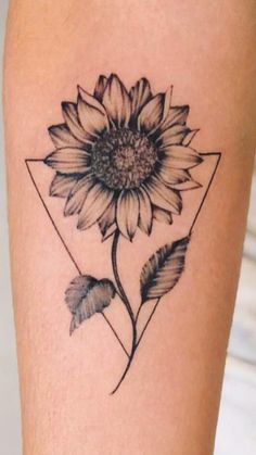 a sunflower tattoo on the leg