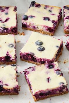 blueberry cheesecake bars are cut into squares