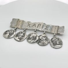 A very fine George Shiebler Etruscan brooch.  In sterling silver.  With five medallions suspended from a bar stamped XAPIE.  Simply a wonderful piece of American Aesthetic Movement jewelry!  Date: 19th Century  Overall Condition: It is in overall good, as-pictured, used estate condition with some very fine & light surface scratches and other signs of expected light wear consistent with age.  Fineness: Marked Sterling for silver fineness.    Marks: STERLING / 379 / Shiebler maker's mark  Measurem Brooch Aesthetic, Movement Jewelry, American Aesthetic, Star David, Aesthetic Movement, Best Wear, A Bar, Makers Mark, Vintage Watches