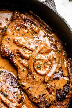 some meat and gravy in a skillet