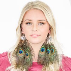 "These gorgeous peacock feather earrings will add bohemian flair to any outfit! They feature 925 sterling silver ear hooks with 5 natural peacock feathers. -925 Sterling Silver ear hooks -100% natural peacock feathers -Approximately 3\" Length -Feathers may vary slightly in size and shape {ABOUT US} Kristin Perry introduced her namesake collection of fashion forward hair accessories in 2010. The line started as an ebay store selling handmade wares to a fashion hungry customer. The brand quickly Bohemian Feather Earrings For Party, Bohemian Party Jewelry With Feathers, Peacock-colored Bohemian Earrings For Gift, Bohemian Peacock Earrings For Gift, Peacock Bohemian Earrings For Gift, Bohemian Peacock Earrings As Gift, Peacock Bohemian Earrings As Gift, Bohemian Green Earrings With Peacock Design, Party Earrings In Peacock Color