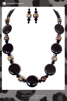 This stunning high fashion necklace would make a fabulous gift for a stylish collector. Snap up this chic black gemstone set today. Elegant Onyx Crystal Necklaces With Natural Stones, Elegant Beaded Necklaces With Stones For Gift, Black Onyx Jewelry With Black Beads, Elegant Pendant Beaded Necklace With Stones, Elegant Crystal Necklace With Stones For Gift, Elegant Beaded Pendant Necklace With Stones, Elegant Crystal Necklace For Gift, Elegant Onyx Crystal Necklaces With Black Beads, Adjustable Black Crystal Gemstone Necklace