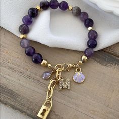 Capture elegance with the captivating Custom Monogram Letter Amethyst Gemstone Bracelet and Necklace Sets that reflect your unique style. Crafted with genuine amethyst gemstones and meticulous handwork, these special pieces will make you feel truly precious. 💎✨ 📦 About product; - The metal apparatus used on the bracelet and necklace is steel and does not tarnish and rust. - The materials used are anti-allergic. - Do not expose to heavy chemicals for a longer lasting use. 🔹 Handmade with genui Sea Shell Bracelet, Bracelet Initial, Gems Bracelet, Bracelet And Necklace, Shell Bracelet, Necklace Sets, Name Bracelet, Letter Necklace, Inner Beauty