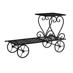 a wrought iron table with wheels and a bench on the bottom one side is black