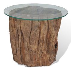 a glass and wood table with a rock in the middle on it's base