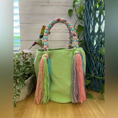 Description: Cute Pastel Green Top Handle Wayuu Bag These Boho Bag Was 100% Hand Knit By Wayuu Women But Designed By Us. The Wayuu Are An Indigenous Tribe In Colombia Known For Their Beautiful Handwoven Work, And This Bag Represents About A Week's Worth Of Work. Details: Handmade Item - Handwoven Color: Pastel Lime Green, Pink, Blue & Purple Material: 100% Acrylic Width: 11" Height: 11" Total Length: 20" Materials: Nylon, Cotton Style: Boho Chic / Classic/ Stylish/ Elegant Kawaii Bag, Small Messenger Bag, Wayuu Bag, Cute Pastel, Leather Shoulder Handbags, Color Pastel, Green Top, Chic Handbags, Boho Bag