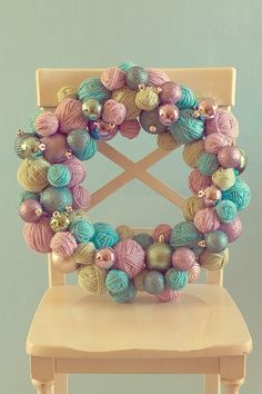 a chair decorated with balls of yarn