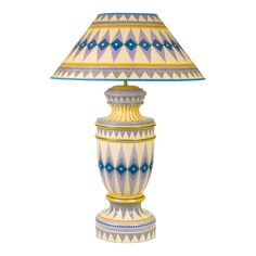 a lamp that is sitting on top of a white surface with a blue and yellow shade