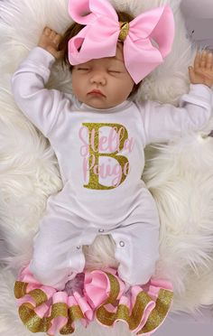 "100% COTTON This adorable customized outfit will have everyone in admiration of your little princess. This customized bodysuit is the perfect outfit for any occasion! Also offers an adorable large handmade ribbon bow with the perfect amount of sparkle and glam! The bodysuit is accented with matching handmade ribbon anklets (which are removable for easy cleaning and style changes, how awesome). The anklets offer the perfect fluffy look for your little one, which we receive endless compliments on Personalized Fitted Onesie For Birthday, Customizable Fitted Onesie For First Birthday, Pink Onesie With Letter Print For First Birthday, Pink Fitted Onesie For Birthday, Personalized Cute Onesie For First Birthday, Personalized Pink Onesie For Birthday, Fitted Pink Onesie For Gift, Fitted Pink Onesie As A Gift, Personalized Pink Onesie For First Birthday