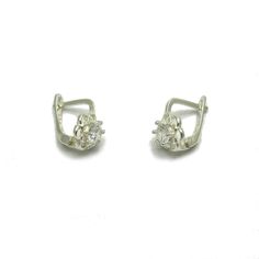 Sterling silver earrings with 3.5mm round CZ - E000652. Stamped 925. Approximate weight 1.2 grams. Dimensions 1.0x0.7cm (0.40x0.28inches). All our jewels are made from solid sterling silver 925/1000 and are carefully crafted by hand in our family workshop. We dispatch your orders in 5 working days, worldwide and the postage is $5. We ship registered priority mail. Please allow 5-7 working days for delivery in Europe and 10-15 working days outside Europe. For any questions - please do not hesitat Silver Huggie Diamond Earrings, Pierced, Silver Pierced Huggie Diamond Earrings, Silver Huggie Earrings With Cubic Zirconia, Silver Sterling Cluster Earrings With Prong Setting, Dainty Silver Diamond Earrings For Formal Events, Silver Dainty Hoop Earrings For Formal Events, Dainty Silver Hoop Earrings For Formal Events, Dainty Silver Hoop Earrings For Formal Occasions, White Sterling Silver Huggie Earrings With Prong Setting