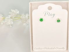 May birthstone, beautiful green cubic zirconia. Emerald birthstone earrings. 5mm round green stone hand set in 6 prong sterling silver setting. Each stone is 1/2 carat total weight. These sparkly green earrings are a perfect gift idea! These gorgeous earrings come in a gift box in an organza bag ready to be given to that special someone. Great gift idea for a birthday, an anniversary, Valentine's Day or any occasion. Great for mothers, sisters, daughters or friends! What a great personalized gif Green May Birthstone Earrings For Anniversary, Green Earrings For Anniversary, May Birthstone, Green Emerald Earrings For Anniversary, May Birthstone Jewelry With Prong Setting For Birthday, Hypoallergenic Green Earrings For May Birthstone, Green May Birthstone Earrings For Gifts, Green Earrings For May Birthstone Gift, Green Earrings As May Birthstone Gift, Green Prong Set Earrings As Gift