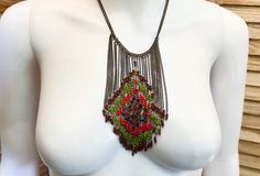 Beautiful boho tribal bib style necklace! ~Condition Great!~ This piece looks great! ~Size & Specifications~ Necklace Length: 18" to 21" inches adjustable Materials: antique brass toned metal and glass Order soon!  It's unlikely we will source another piece like this! We ship all orders within 1-3 days.  If you need an order sent  sooner rather than later send us a message or purchase our faster shipping speed while checking out.  We do everything we can to get your item to you as promptly as po Bohemian Chain Necklace With Colorful Beads For Jewelry Making, Bohemian Adjustable Chain Necklace For Festivals, Bohemian Multicolor Chain Necklace As Gift, Bohemian Beaded Chain Necklace For Festivals, Bohemian Beaded Chain Necklace, Handmade Bohemian Chain Necklace, Bohemian Long Beaded Necklace With Chain, Bohemian Adjustable Chain Necklace, Multicolor Bohemian Chain Necklace With Adjustable Chain