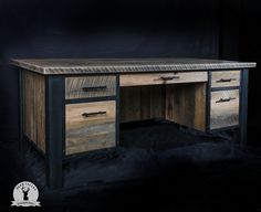 an old wooden desk with two drawers on one side and a metal handle on the other