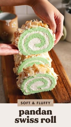 someone is holding some kind of cake roll with green and white frosting on it