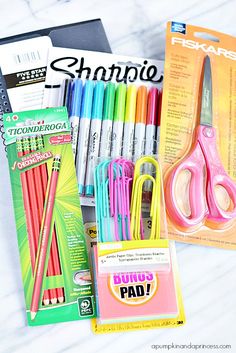 the contents of a school supply box including pens, markers and pencils are shown