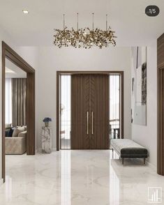 an elegant entry way with marble floors and wooden doors, chandelier hanging from the ceiling