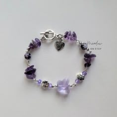 Handmade bracelet ✿ Made with glass beads, glass crystal beads, quartz, and metal accents ✿ Silver, white, purple, and iridescent lavender  ✿ Toggle Clasp Crystal Jewelry Bracelet, Metal Keychain Design, Diy Metal Bracelets, Dark Purple Bracelet, Purple Charm Bracelet, Purple Beads Bracelets, White Bracelet Ideas, Purple Bracelet Ideas, Purple Beaded Jewelry