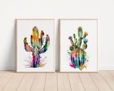 two watercolor paintings of cactuses are on the wall in front of a wooden floor