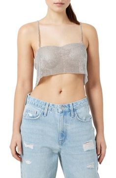 This festival-ready tank is designed in a cropped silhouette and covered in lustrous metallic studs. 6 1/2" center front length (size M/L) Sweetheart neck Sleeveless 50% plastic, 50% polyester Hand wash, line dry Imported Metallic Cropped Crop Top For Party Season, Metallic Cropped Top For Party Season, Metallic Sleeveless Halter Top For Night Out, Spring Embellished Sleeveless Halter Top, Fitted Metallic Glamorous Crop Top, Glamorous Embellished Sleeveless Crop Top, Metallic Crop Top For Summer Night Out, Sequin Crop Top For Club In Spring, Spring Sequin Crop Top For Club