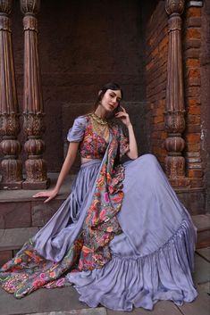 The Grey Drape Lehenga Set features a sophisticated grey lehenga with intricate detailing, paired with a stylish blouse and a matching drape. Perfect for festive celebrations, this elegant ensemble blends traditional charm with contemporary style, making it ideal for weddings, festivals, and special occasions. Drape Lehenga, Grey Lehenga, Grey Drapes, Raw Silk Lehenga, Lehenga Suit, Stylish Blouse, Silk Lehenga, The Grey, Shades Of Yellow