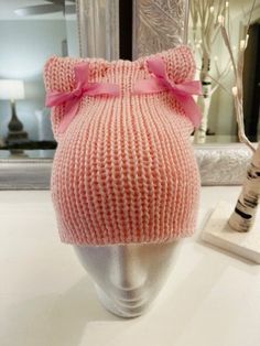 This Pink Coquette Cat Hat is embellished with matching bows and is a charming accessory that radiates elegance and playfulness. Its soft hues and intricate detailing make it a whimsical addition to any feline ensemble, creating a delightful and fashionable look that captures the essence of cuteness and style. Cute Adjustable Hat With Bow, Cute Knitted Cat Ears Hat, Cute Knitted Fitted Hat, Cute Pink Winter Mini Hats, Cute Pink Knitted Hat, Cute Pink Hand Knitted Beanie, Cute Fitted Hats As Gifts, Cute Pink Yarn Beanie, Coquette Accessories