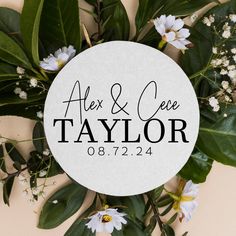 a white circle with the words alex and cece taylor on it surrounded by flowers