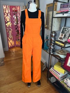 I mean if you have to go to jail, do it in Italy and you'll get a pair of these totally killer orange cotton overalls! these are unisex as far as I can tell, they have side buttons and an elasticated back waist  otherwise classic overall design unworn they ship to you fresh and ready to wear shown on a size 6 ladies form, check the measurements below to know how they will fit you waist 28-32' hips 36' rise 10' inseam 33' a vintage or recycled item, NO RETURNS OR REFUNDS so message with us before you buy if you have any questions follow our INSTAGRAM, we show all our pieces there first and they often sell direct before we can post them here go to @FAB208NYC ON INSTAGRAM go to our ETSY SHOP to see all our other overalls and other vintage pieces https://www.etsy.com/shop/fab208nyc Orange And White Checkerboard Overalls, Orange Overalls Layered, Orange Overalls, Go To Jail, Cotton Overalls, Overalls Outfit, I Can Tell, Vintage Pieces, Do It