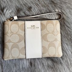 Coach Wristlet In Gold/Khaki Good As New Tags In Wristlet Card Holders Inside Wrist Strap Beige Clutch With Wrist Strap For Gift, Beige Clutch With Wrist Strap As Gift, Beige Rectangular Clutch With Wrist Strap, Chic Beige Bags With Wrist Strap, Elegant Beige Clutch Wristlet, Elegant Beige Clutch With Wrist Strap, Adjustable Beige Rectangular Wristlet, Coach Beige Pouch Wristlet, Beige Coach Pouch Wristlet