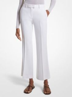 Our coveted Haylee trousers return with a seasonal update for spring. Crafted in Italy from double crepe sablé, this elevated pair is sharply tailored with flared legs and an above-the-ankle hem to create a streamlined silhouette. Finished with side pockets and crisp pleats down the front, they look especially chic paired with sleek sandals and a cashmere sweater or blazer. Fitted White Wide Leg Pants With Pressed Crease, Elegant Fitted Pants With Flared Cuffs, White Flared Formal Bottoms, Elegant Flare Bottoms With Pressed Crease, Elegant Wide Leg Flared Pants, Elegant Formal Pants With Flared Cuffs, Elegant Fitted Bottoms With Flared Cuffs, Fitted Bottoms With Flared Cuffs For Work, Elegant Wide Leg Flare Pants For Spring