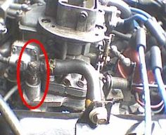 an image of a car engine with the red circle in it's middle section