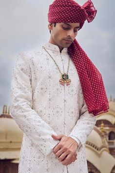 Ivory sherwani with beads, sequin and thread embroidery in geometric pattern. Paired with choga and churidar. - Aza Fashions White Sherwani With Mirror Work For Eid, Elegant White Bandhgala With Mirror Work, Diwali White Sherwani With Mirror Work, White Bandhgala With Mirror Work For Eid, Traditional Sherwani With Mirror Work, Traditional Sherwani With Mirror Work For Transitional Season, Traditional Sherwani With Mirror Work For Eid, Traditional Sherwani With Mirror Work For Diwali, Eid Traditional Sherwani With Mirror Work