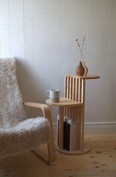 a chair and table in a room with white walls