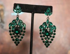 Green Jeweled Crystal Drop Earrings, Green Jeweled Earrings For Formal Occasions, Green Crystal Chandelier Earrings For Party, Green Jeweled Chandelier Earrings For Wedding, Glamorous Green Jeweled Earrings, Glamorous Green Chandelier Earrings For Wedding, Green Evening Jewelry, Green Crystal Drop Earrings For Formal Occasions, Green Dangle Chandelier Earrings For Formal Events