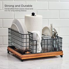 the dish rack is filled with dishes and utensils in it, along with two rolls of toilet paper