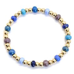 Beautiful Blue Bracelet Stacks Create a uniquely eye-catching blue-tone wrist stack with these glass seed bead stretch bracelets. Handcrafted in NYC in gold fill or sterling silver. 14K gold-filled or sterling silver 2mm, 3mm, & 4mm beads; colorful glass seed beads; 6mm glass bubble beads; stretch style. Water safe, tarnish-resistant. Great solo or stacked. Handmade in NYC. View gold ball bracelets. View silver bead bracelet. View rose gold bead bracelet. Bead Bracelets For Boys, Beaded Bracelets Blue, Seed Bead Stretch Bracelets, Colorful Beaded Bracelets, Nyc View, Rose Gold Beaded Bracelet, Bracelets Sets, Bubble Beads, Wrist Stack