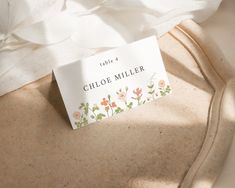 a label on the side of a white shirt that says, take 4 chloe miller