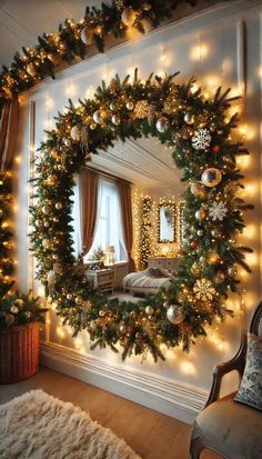 a christmas wreath hanging on the wall in front of a mirror with lights around it